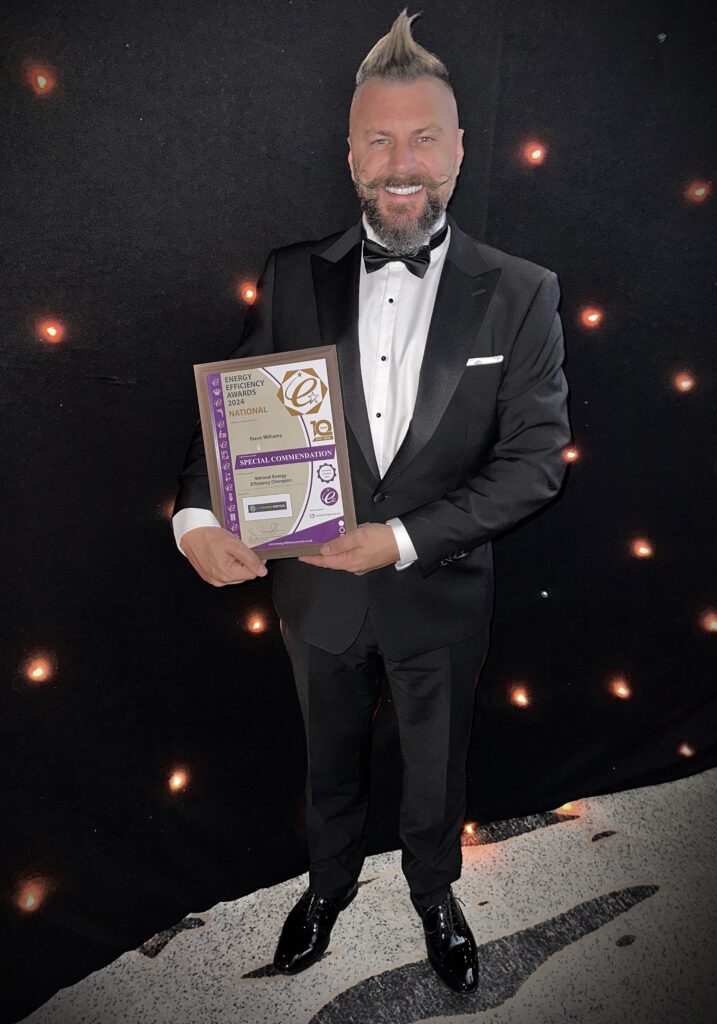 Steve Williams holding his award