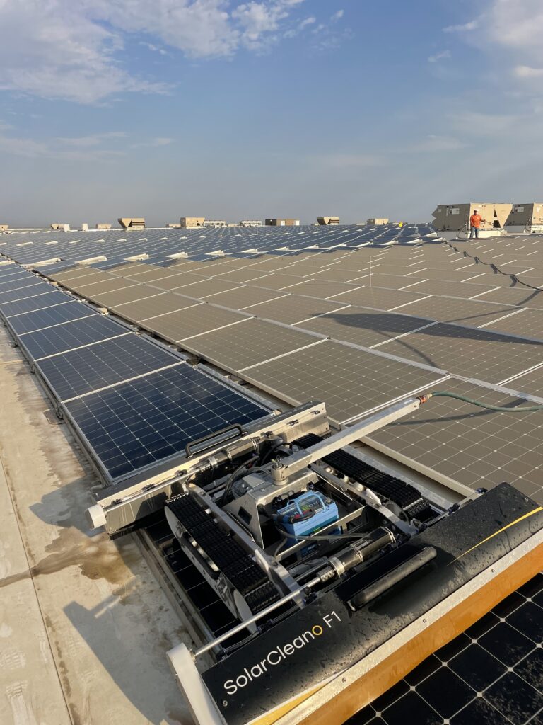 Robotic solar panel cleaner on solar panels