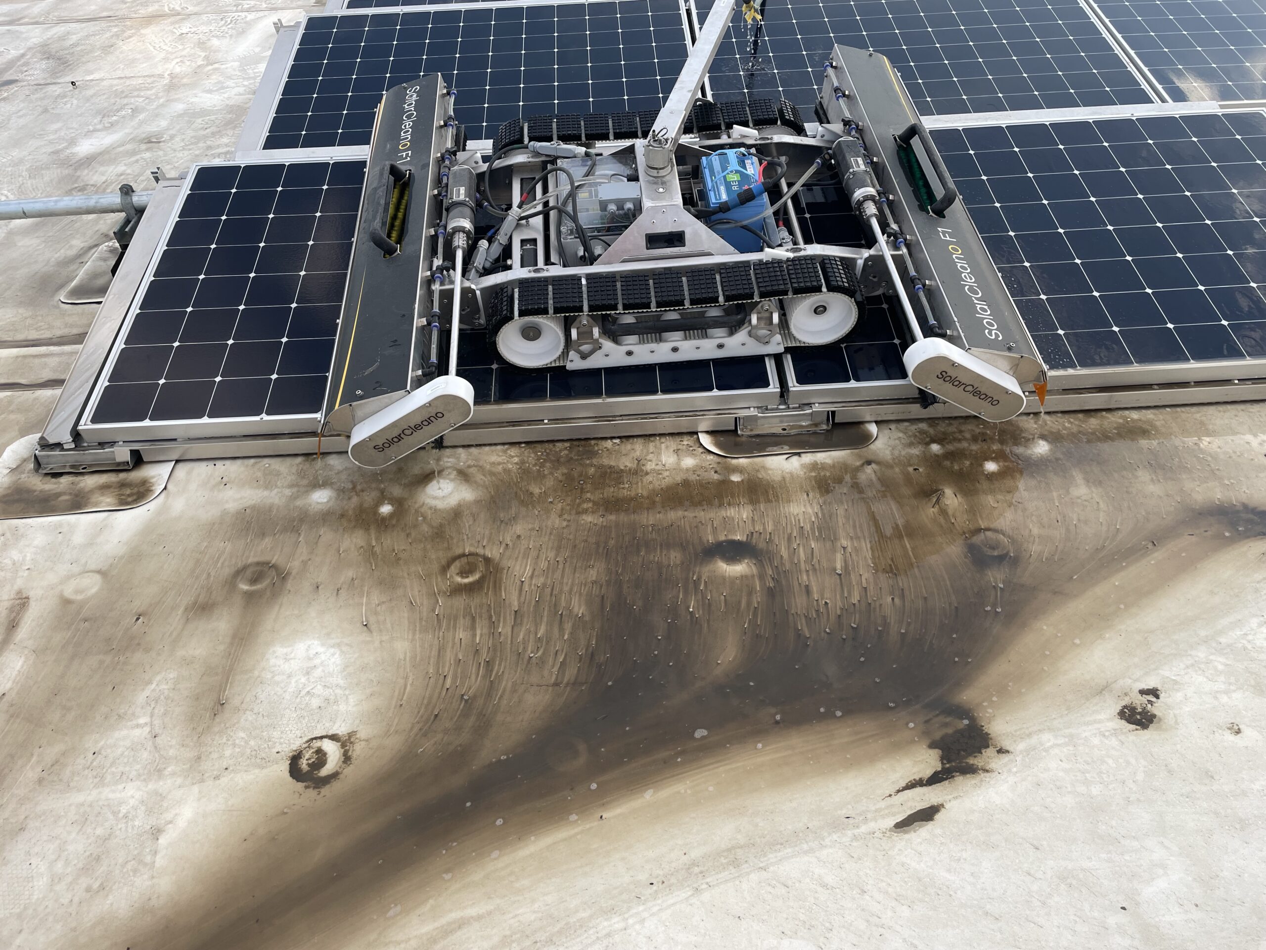 a solar panel clenaing robot on solar panels