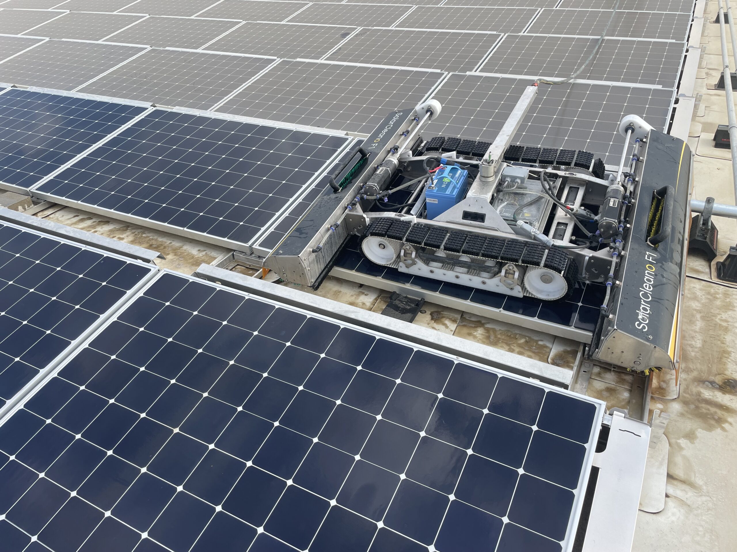 A solar panel cleaning robot cleaning panels