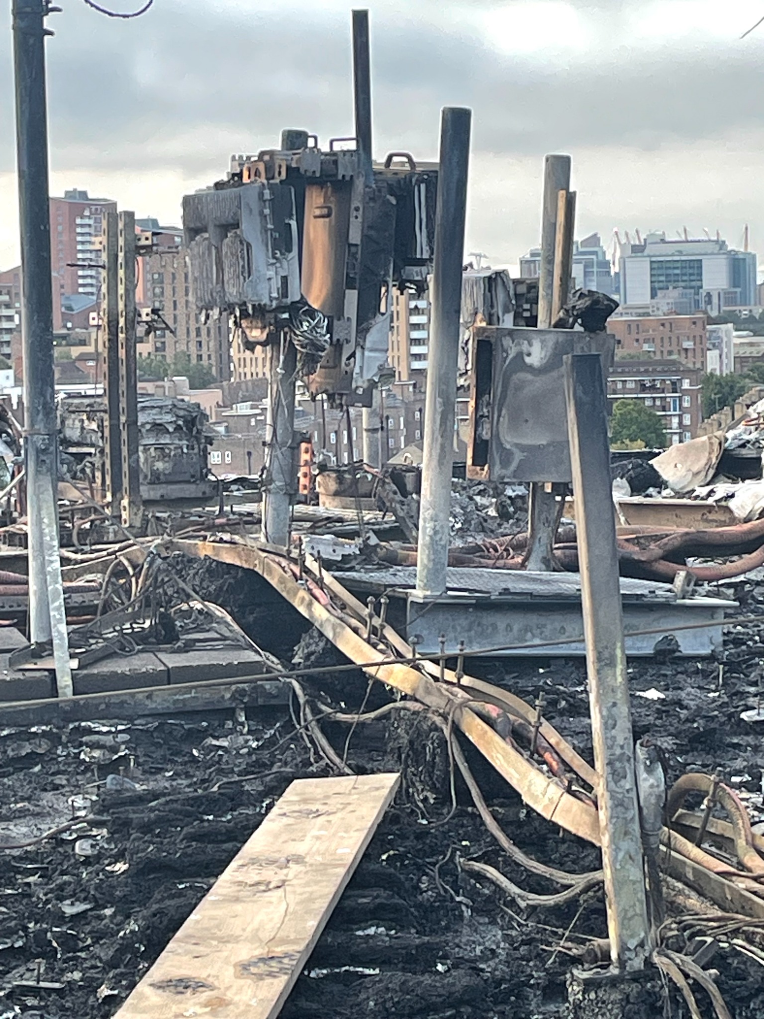 Severely fire-damaged photovoltaic equipment and rooftop cabling